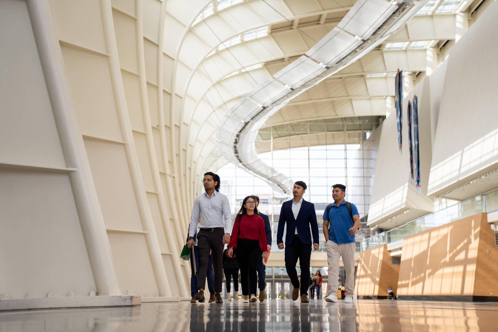 people walking in devos place